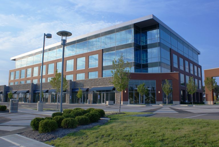 Wide shot of a large office building with many windows